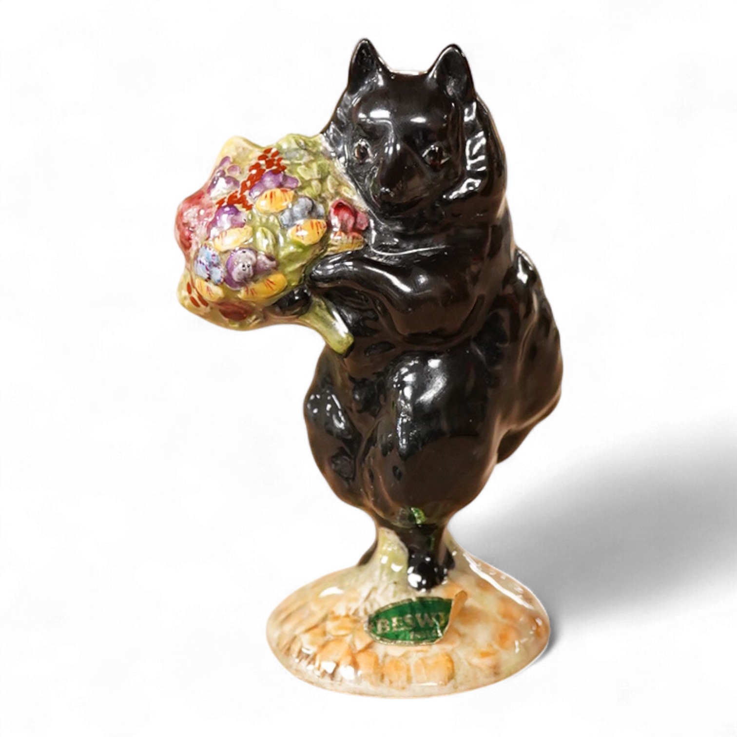 A Beatrix Potter, stamped F Warne and Co Ltd, Beswick figure of “Duchess” with flowers,10cm high